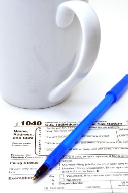 Closeup of IRS form 1040 on white background. clipart