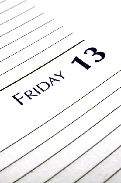 stock image Personal planner opened to Friday the 13th.