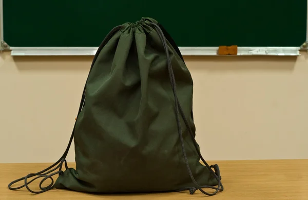 Bag at school on a table — Stock Photo, Image