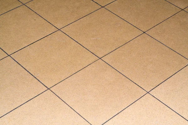 Una piastrella è disposta sul pavimento — Foto Stock