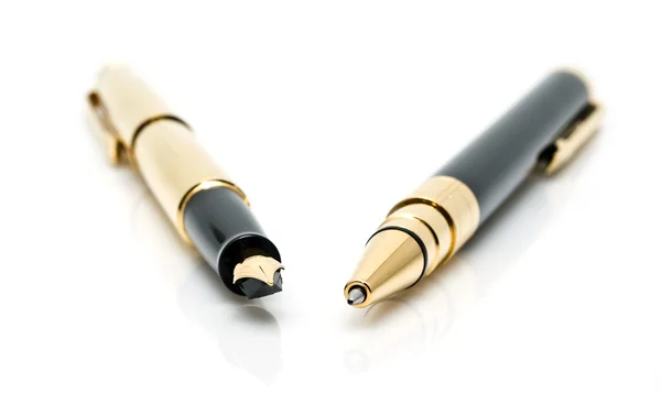 Bolígrafos de oro — Foto de Stock