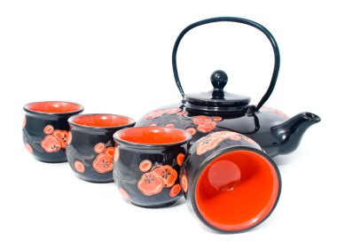 Black tea-pot with the tipped glass over clipart