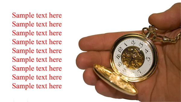 Reloj de oro está en una mano — Foto de Stock