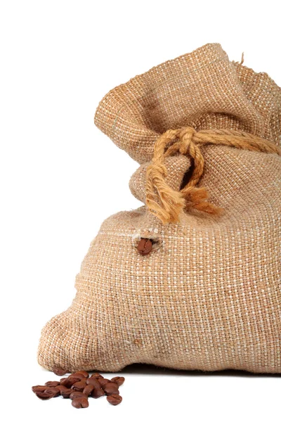 Bag of coffee and coffee-grain pop out of the bag in isolation Royalty Free Stock Photos