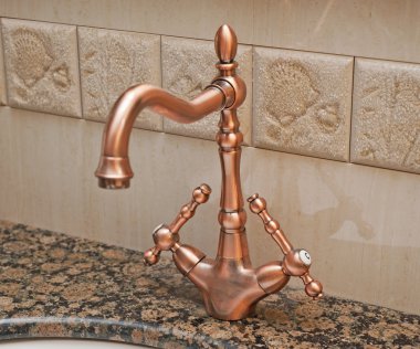 Bathroom tap on a washbasin clipart