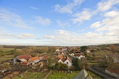 View over a farming village in the country clipart