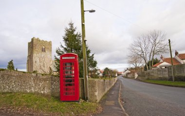 View down a traditional english village clipart