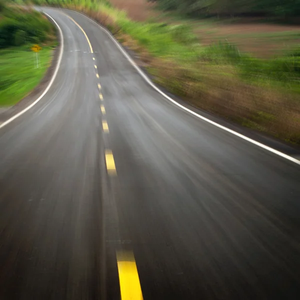 The road curves down — Stock Photo, Image