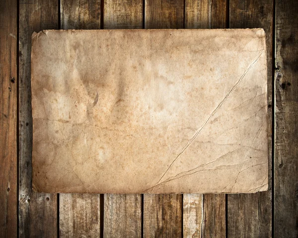 Old paper on Grunge wood — Stock Photo, Image