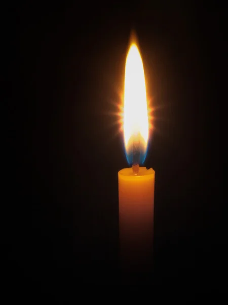 Yellow candle bright light — Stock Photo, Image