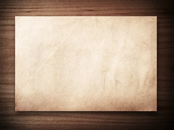 Old paper on wood — Stock Photo, Image