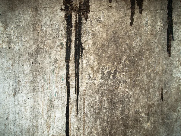 Černá barva pokles na grunge staré zdi — Stock fotografie