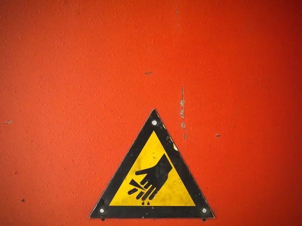 Желтая предупреждающая рука — стоковое фото