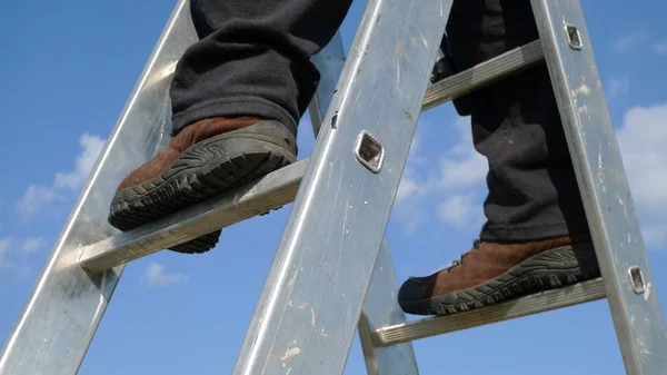 stock image Man on a ladder