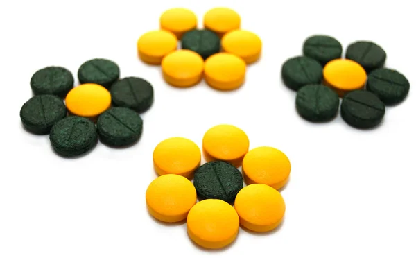 Zöld és sárga tabletta formájában a virágok — Stock Fotó