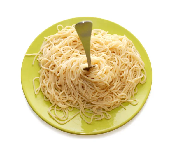 Pasta on green plate woth fork — Stock Photo, Image