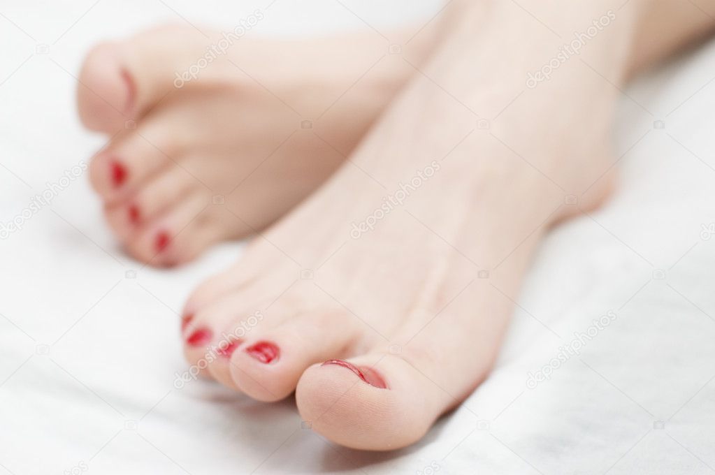 Woman foots with red nails