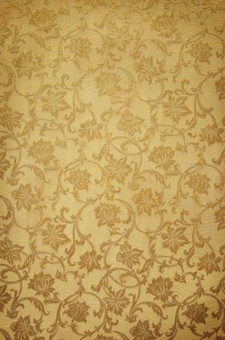 Golden pattern on wallpaper. Ideally as background clipart