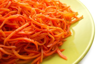Spicy carrot con green plate. Long slices. clipart