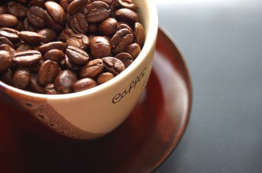 Coffee beans in cup clipart