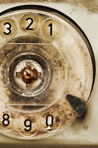 Grunge: rotary dial of old broken phone — Stock Photo, Image