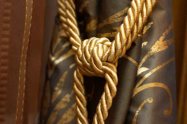 stock image Gold knot on luxury cutrain tassel