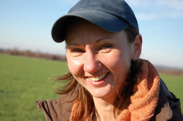 stock image Smiling woman in cap. Outdoors