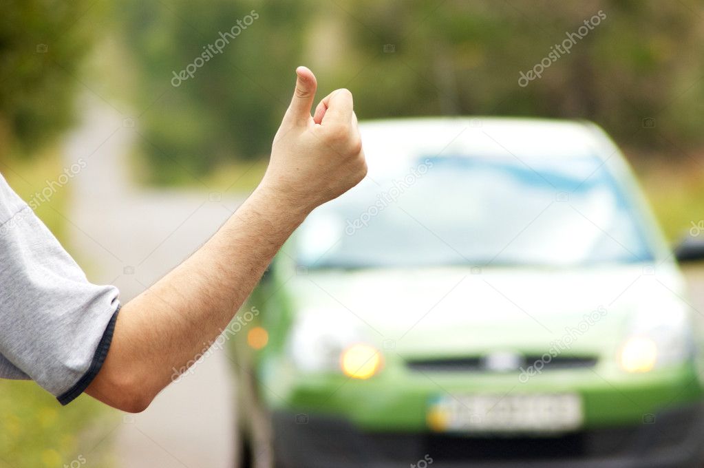 Man hitching on road