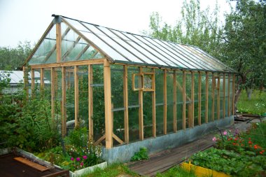 Greenhouses for growing vegetables or flowers in a volatile climate clipart