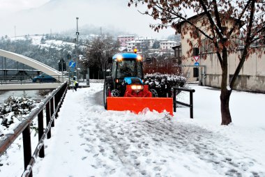 Bulldozer shoveling snow clipart