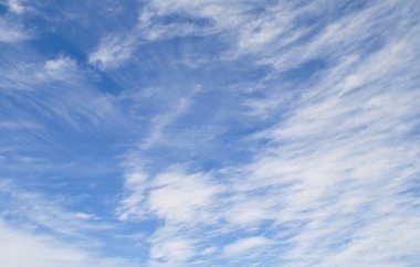 White clouds in a blue sky clipart