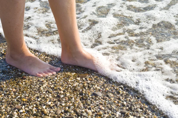 Feet in sea waves — Stock Photo, Image