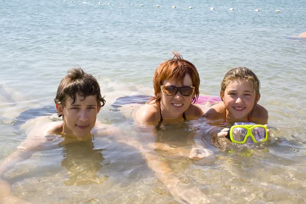 Children with mother on the beach — Stock Photo, Image
