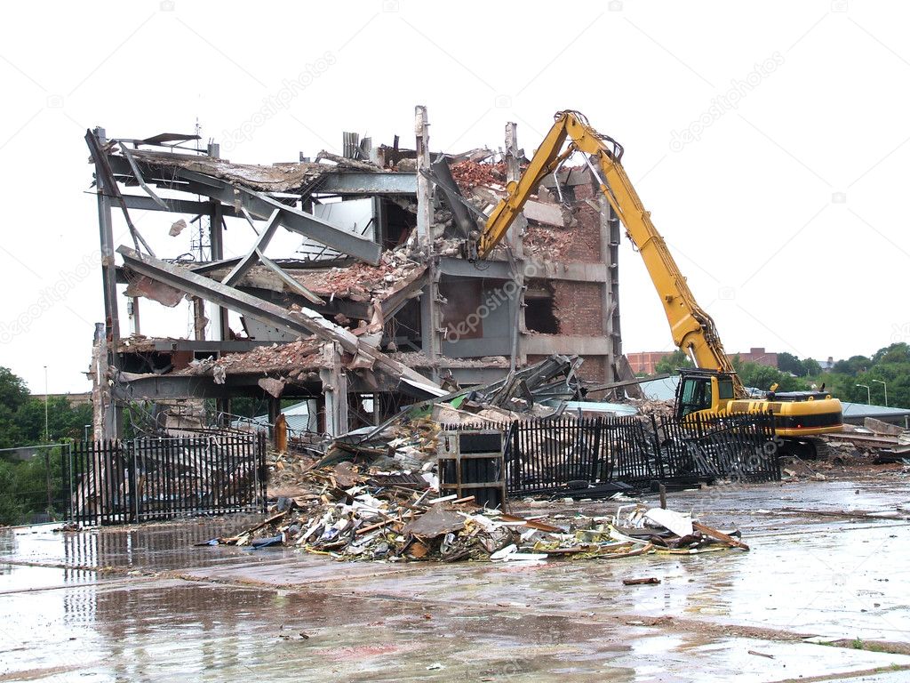 A Mechanical Excavator Demolishing an Old Building.