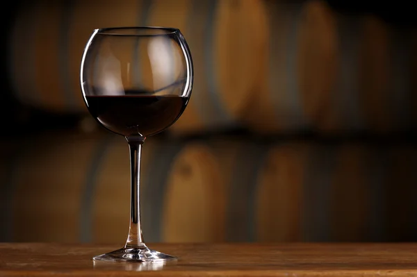 Glass of wine in wine cellar — Stock Photo, Image