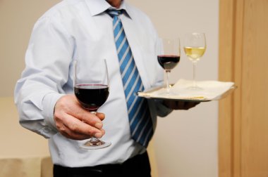 Waiter giving wine clipart