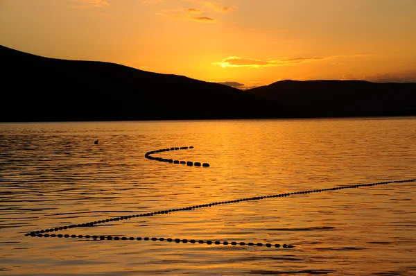 Sunset with fishing nets — Stock Photo, Image
