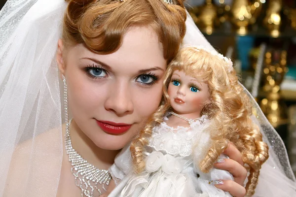 Bride with a doll — Stock Photo, Image