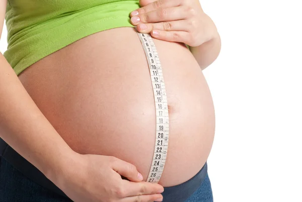 Meten van zwangere buik — Stockfoto