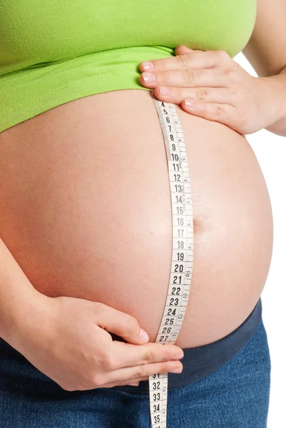 Měření těhotné břicho — Stock fotografie