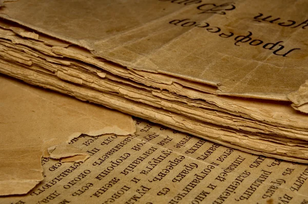 Closeup of an old book with tattered pages and slavonic text — Stock Photo, Image