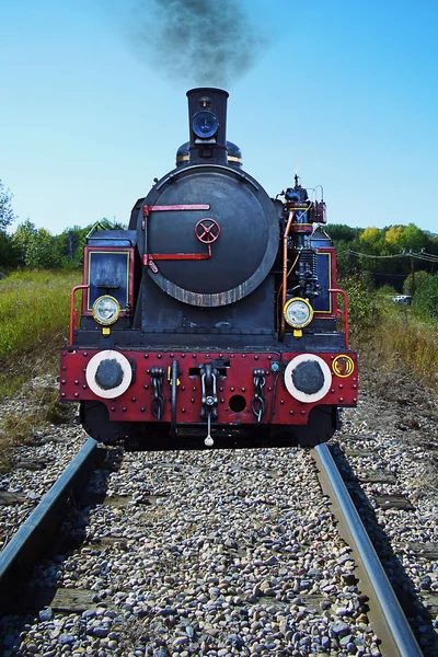 Stock image Old locomotiveon the traks with smog puff