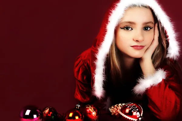 Portrait of beautiful sexy girl wearing santa claus clothes on red backgrou — Stock Photo, Image