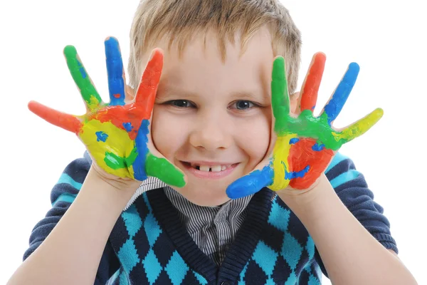 Leende pojke med handflatorna målade av en färg. — Stockfoto