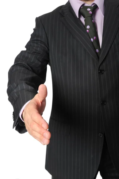 Businessman in a suit holds out his hand — Stock Photo, Image
