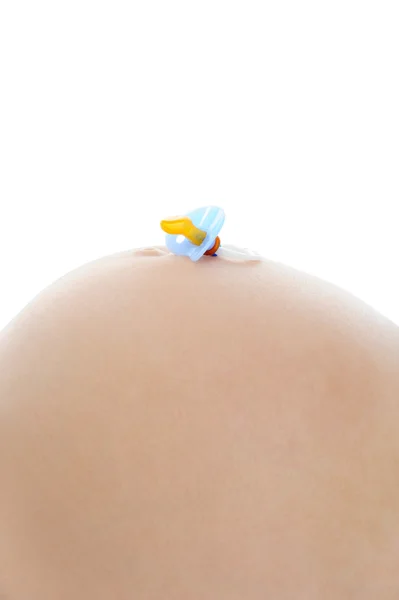 Sutek dziecko na brzuchu w ciąży mama — Zdjęcie stockowe