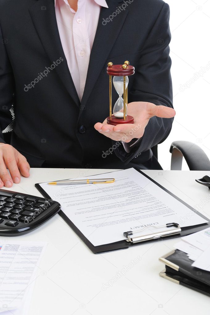 Businessman with hourglass in hand.