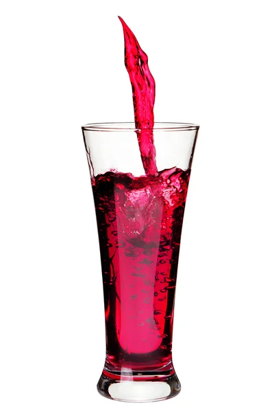 Vidrio aislado con salpicaduras refrescante una bebida de color rojo en w —  Fotos de Stock