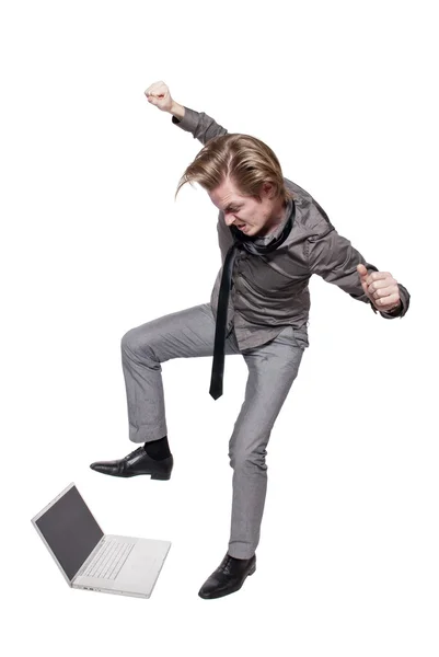 Young angry man destroys a computer — Stock Photo, Image