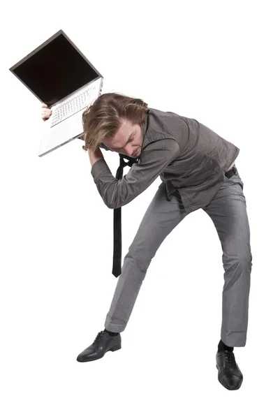 stock image Young angry man destroys a computer. Studio photo on white background.